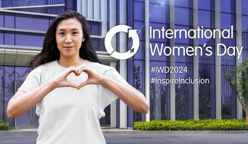 An image of a woman making a heart shape with her hands along with International Womens Day logo